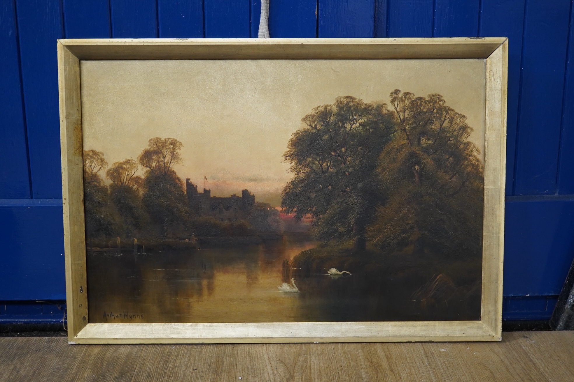 Arthur Wynne (19th. C), oil on canvas, River landscape with swans, signed and indistinctly inscribed verso, 49 x 75cm. Condition - fair to good